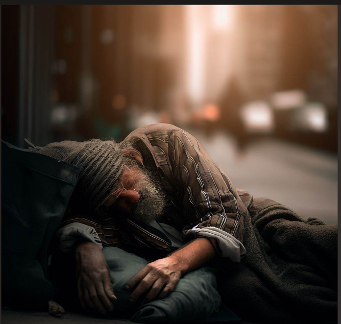 create a phote of an homeless man sleeping on the street of new yorkk